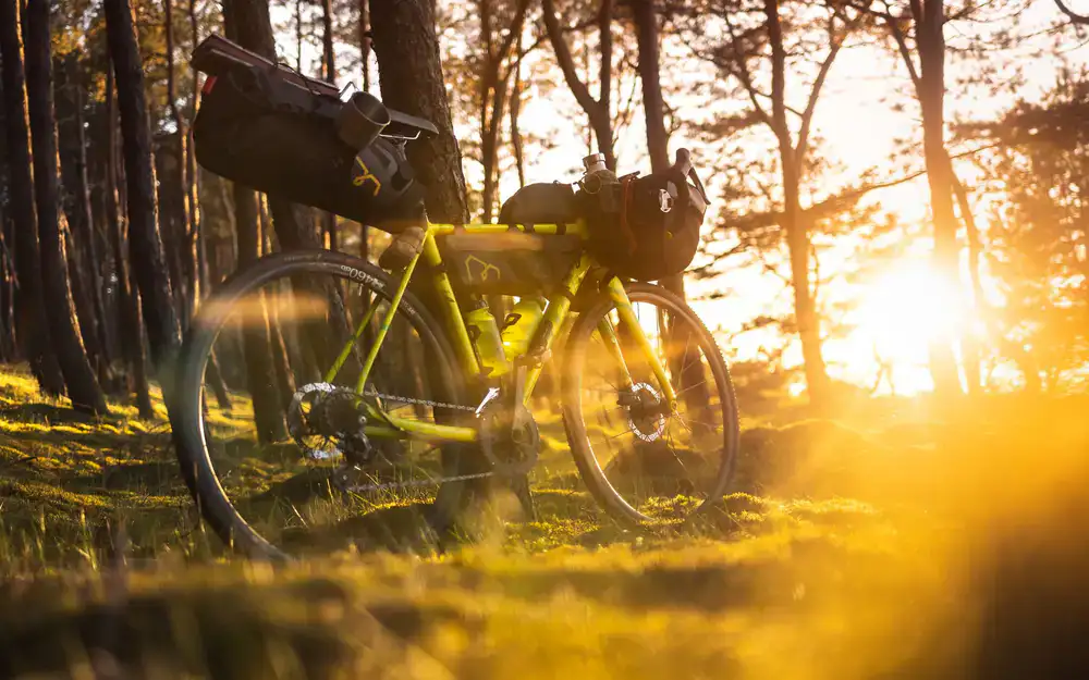A robust steel gravel bike frame with mounting points