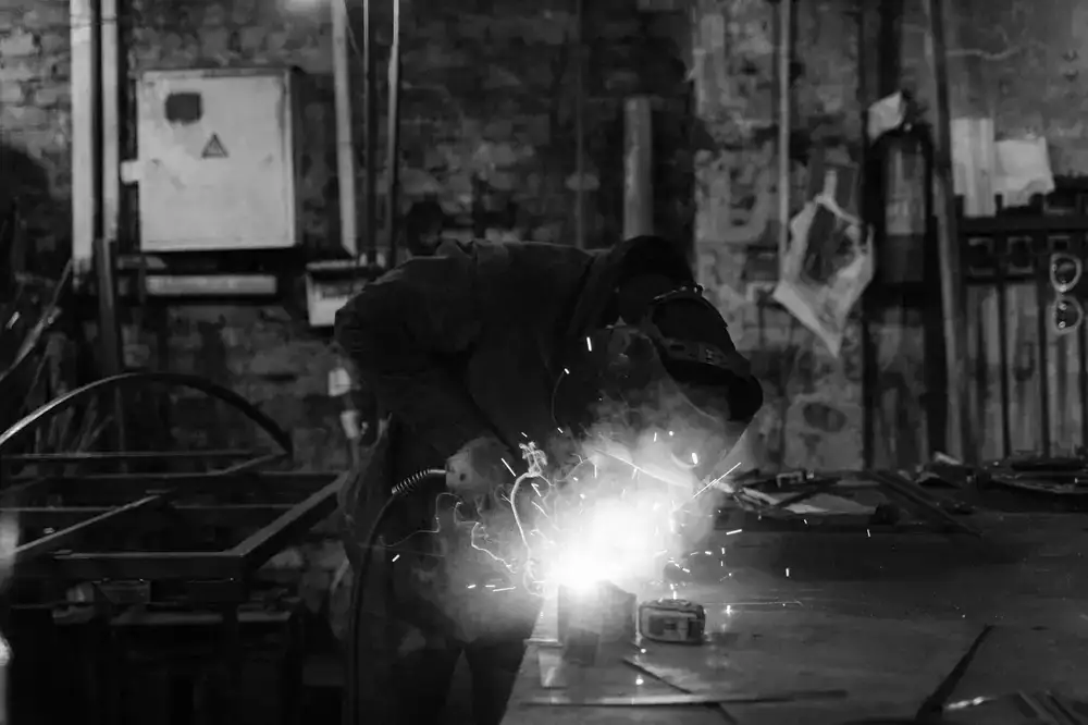 Welding a custom steel bicycle frame in the workshop