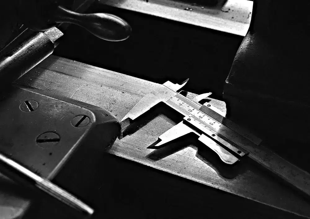 Precision measuring tools resting on a workshop bench