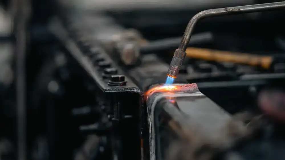 Close up of a precise weld on a raw steel bicycle frame